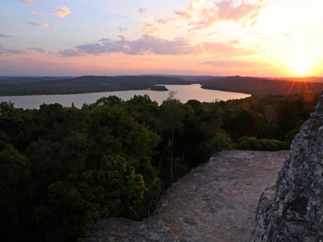 Climb Yaxhá ruins for sunset drinks