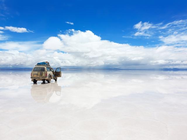 Drive over salt flats at sunrise