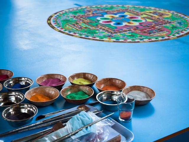 Make sand mandalas with a monk