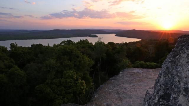 Climb Yaxhá ruins for sunset drinks