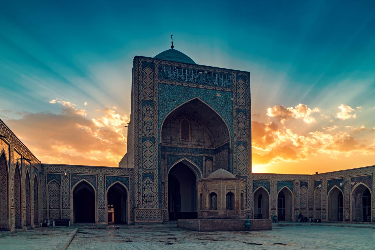 Symmetrical image of a beautifully tiled ceiling in Samarkand, Uzbekistan with blue and gold colouring